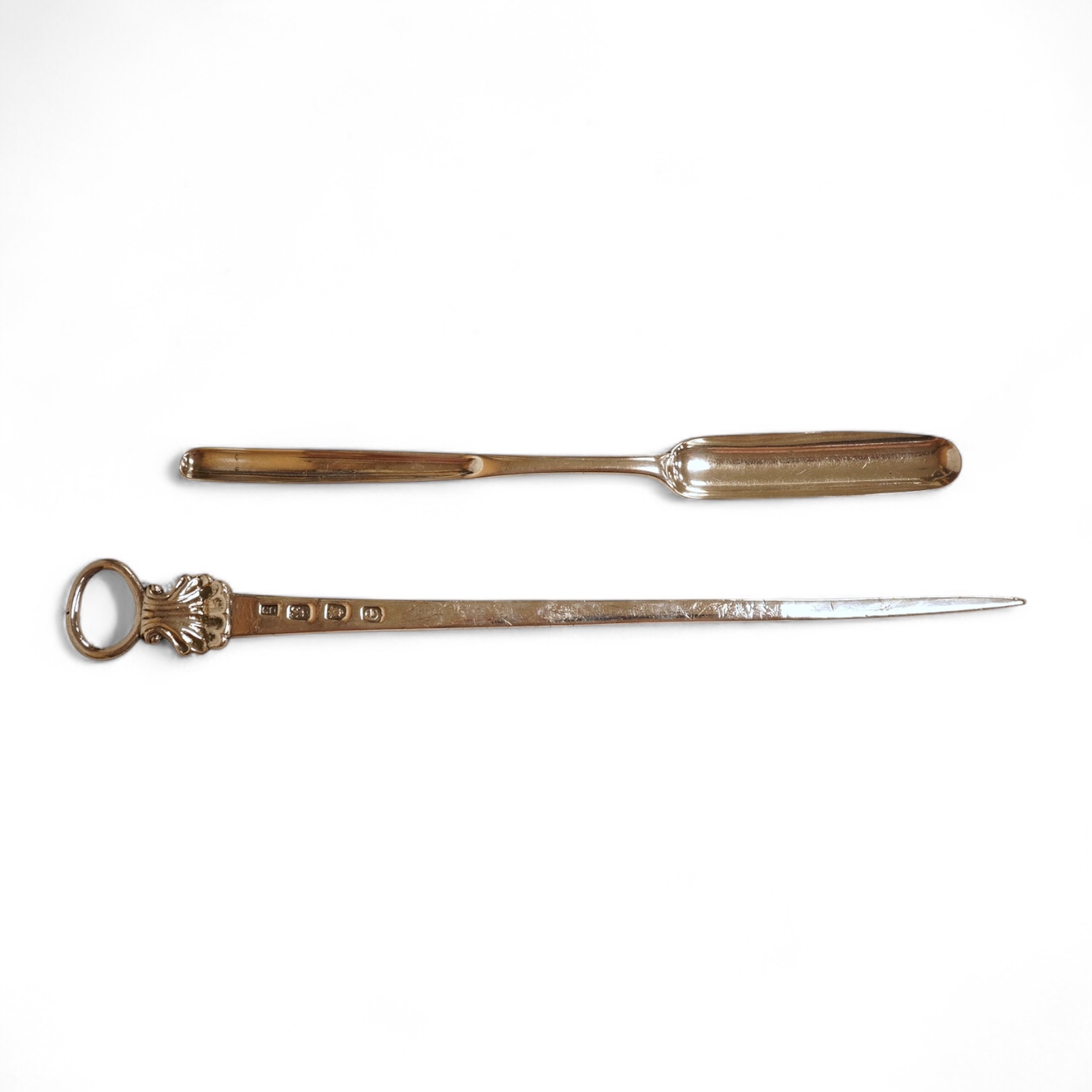 A George III silver meat skewer, with shell terminal and ring handle, Charles Hougham, London, 1780, 26.3cm, together with a George III silver marrow scoop, with engraved crest, Samuel Wintle, London, 1785.